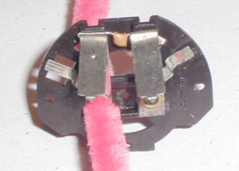 Hornby Ringfield motor brush housing being cleaned